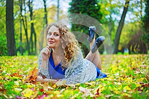 Plussize model in the autumn park photo