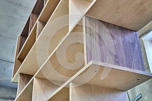 Plywood bookshelves. Production of wood furniture. Furniture manufacture. Close-up