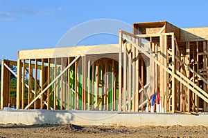 plywood house frame against the blye sky