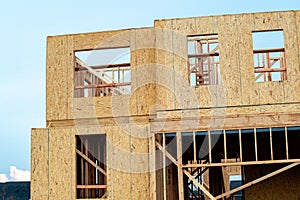 plywood walls of a new house development truss unfinished framework