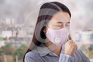 PM2.5. people feeling sick from air pollution, environment has harmful or poisonous effects. woman in the city wearing face mask