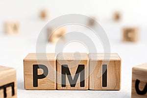 PMI - acronym from wooden blocks with letters