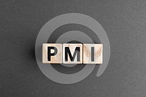 PMI - acronym from wooden blocks with letters