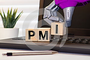 PMI - acronym from wooden blocks with letters, abbreviation PMI Private Mortgage Insurance photo