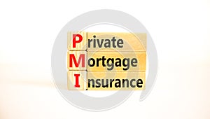 PMI private mortgage insurance symbol. Concept words PMI private mortgage insurance on blocks on a beautiful white table, white photo
