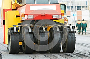 Pneumatic asphalt roller at work photo