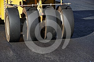 Pneumatic asphalt roller at work