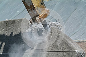 Pneumatic hammer destroing a wall