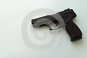 Pneumatic pistol isolated over white background. Handgun for your safety. Weapon concept. Shooting gun indoor. Protection from