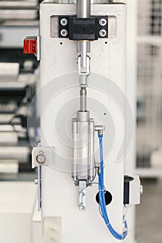 Pneumatic piston unit on industrial machine