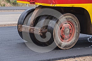 Pneumatic tyred roller compactor at asphalt road