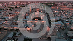Po-i-Kalyan mosque complex in Bukhara and Kalyan Minaret at sunset, drone aerial