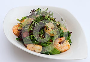 Poach prawns and green leaves salad in a bowl photo