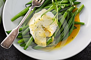 Poached egg with bearnaise sauce photo