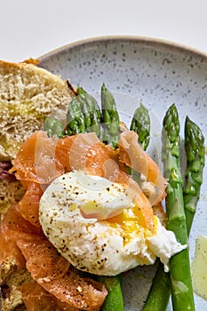 Poached Egg, Smoked Salmon and Fresh Asparagus, close up on plate