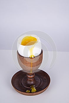 Poached egg in a wooden egg holder