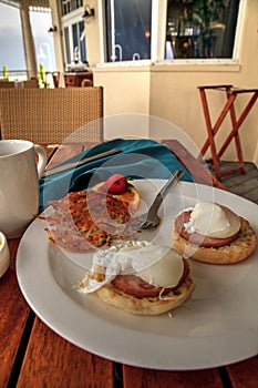 Poached eggs, Canadian bacon, bearnaise sauce, and hash browns