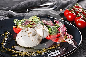 Poached eggs with fresh vegetable salad on grey plate background. Healthy vegetarian breakfast, clean eating, diet food, closeup.