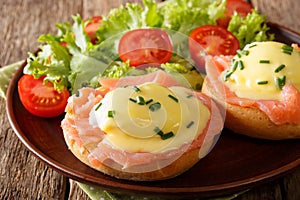 Poached eggs with smoked salmon, hollandaise sauce and vegetable