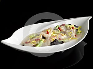Poached Garoupa Fillet with Chrysanthemum and Ginger in Superior Rice Wine Broth served dish isolated on background top view food photo