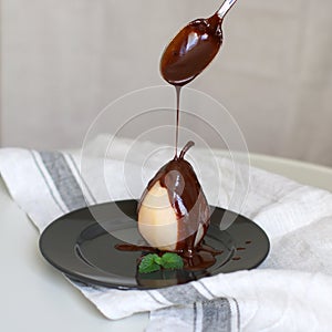 Poached pear with chocolate.