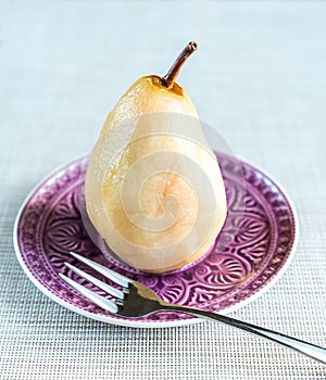 Poached pear in white wine