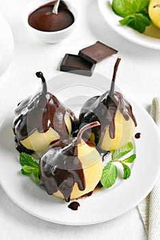 Poached pears with chocolate sauce