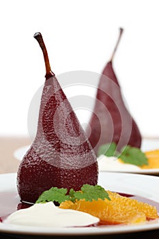 Poached pears with creme fraiche and oranges