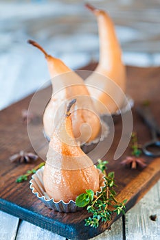 Poached pears with spices in syrup