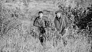 Poacher partner in crime. Activity for real men concept. Hunters gamekeepers looking for animal or bird. Illegal hunting