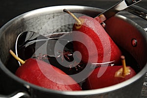 Poaching pears in mulled wine, closeup