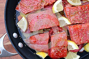 Poaching sockeye salmon fillets in a pan