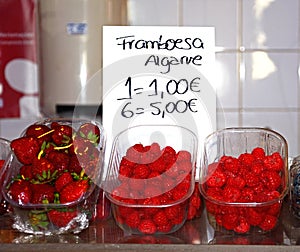 Raspberries and strawberries for sale, Olhao. photo