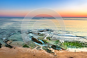 Poca Beach in Estoril, Portugal at Colorful Sunset