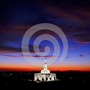 Pocatello LDS Mormon Latter-Day Saint Temple at Sunset with Glowing Lights