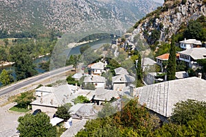 Pocitelj cityscape with river