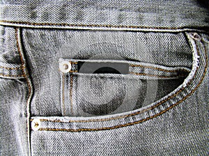 Pocket of gray jeans close-up
