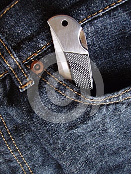 Pocket knife in jeans pocket