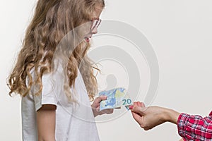 A Pocket money. Mom gives the child cash.