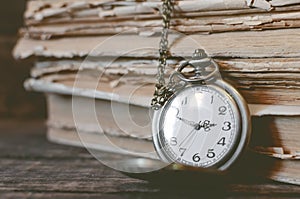 Pocket watch and books.