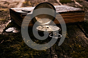 Pocket watch with an old antique bible book and ancient copper c