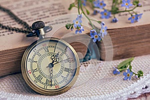 The pocket watch and old book