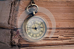 The pocket watch and old books