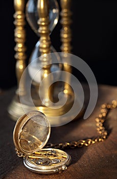 Pocket watch and sandglass