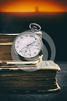 Pocketwatch and books