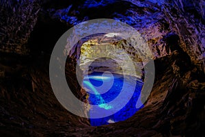 Poco Encantado, blue lagoon with sunrays inside a cavern in the Chapada Diamantina, Andarai, Bahia, Brazil