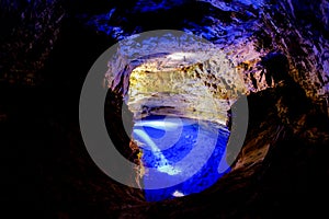 Poco Encantado, blue lagoon with sunrays inside a cavern in the Chapada Diamantina, Andarai, Bahia, Brazil photo