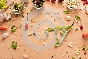 Fava beans on a wooden kitchen table