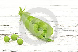 Pod of green young peas with peas