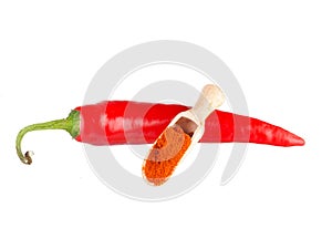 Pod of red hot chili pepper and ground paprika